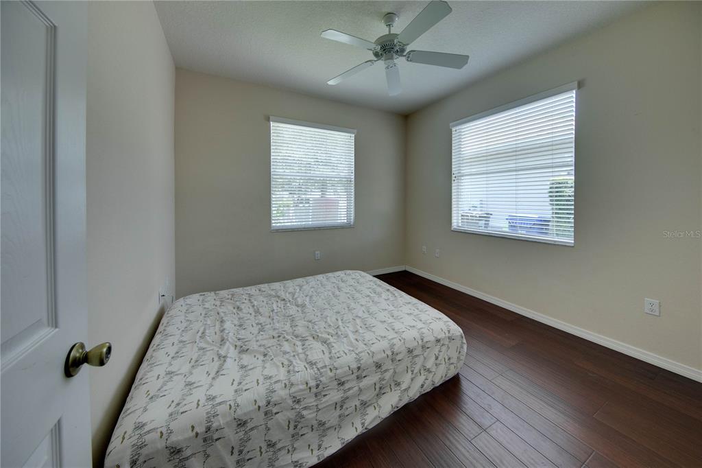 5291 Echo Lane Sarasota, FL 34233 - Photo 22 of 32 a bedroom with a bed and a window