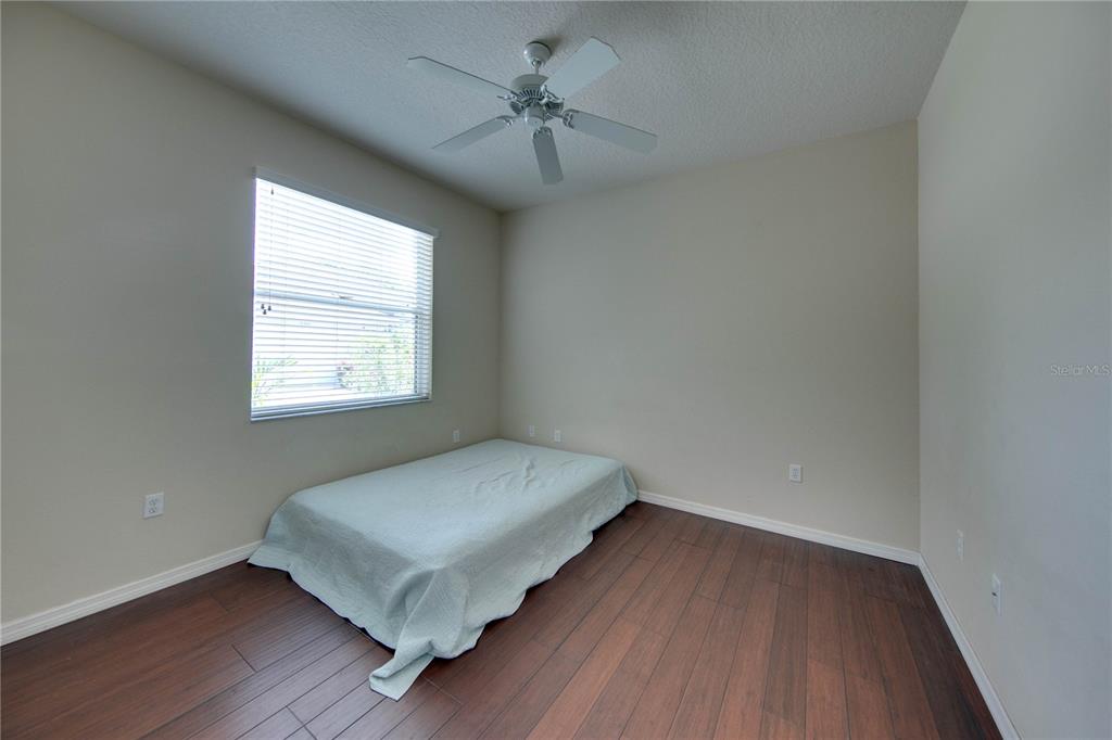5291 Echo Lane Sarasota, FL 34233 - Photo 25 of 32 a view of room with window and wooden floor