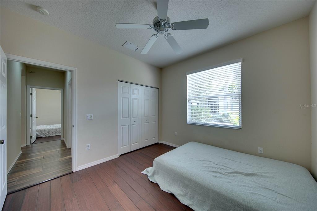 5291 Echo Lane Sarasota, FL 34233 - Photo 26 of 32 wooden floor in an empty room with a window