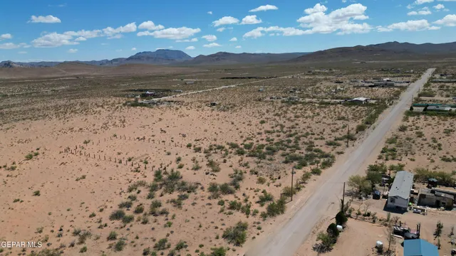 a view of an ocean beach and mountain