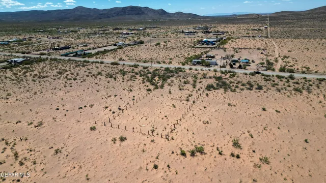 a view of a swimming pool with a yard