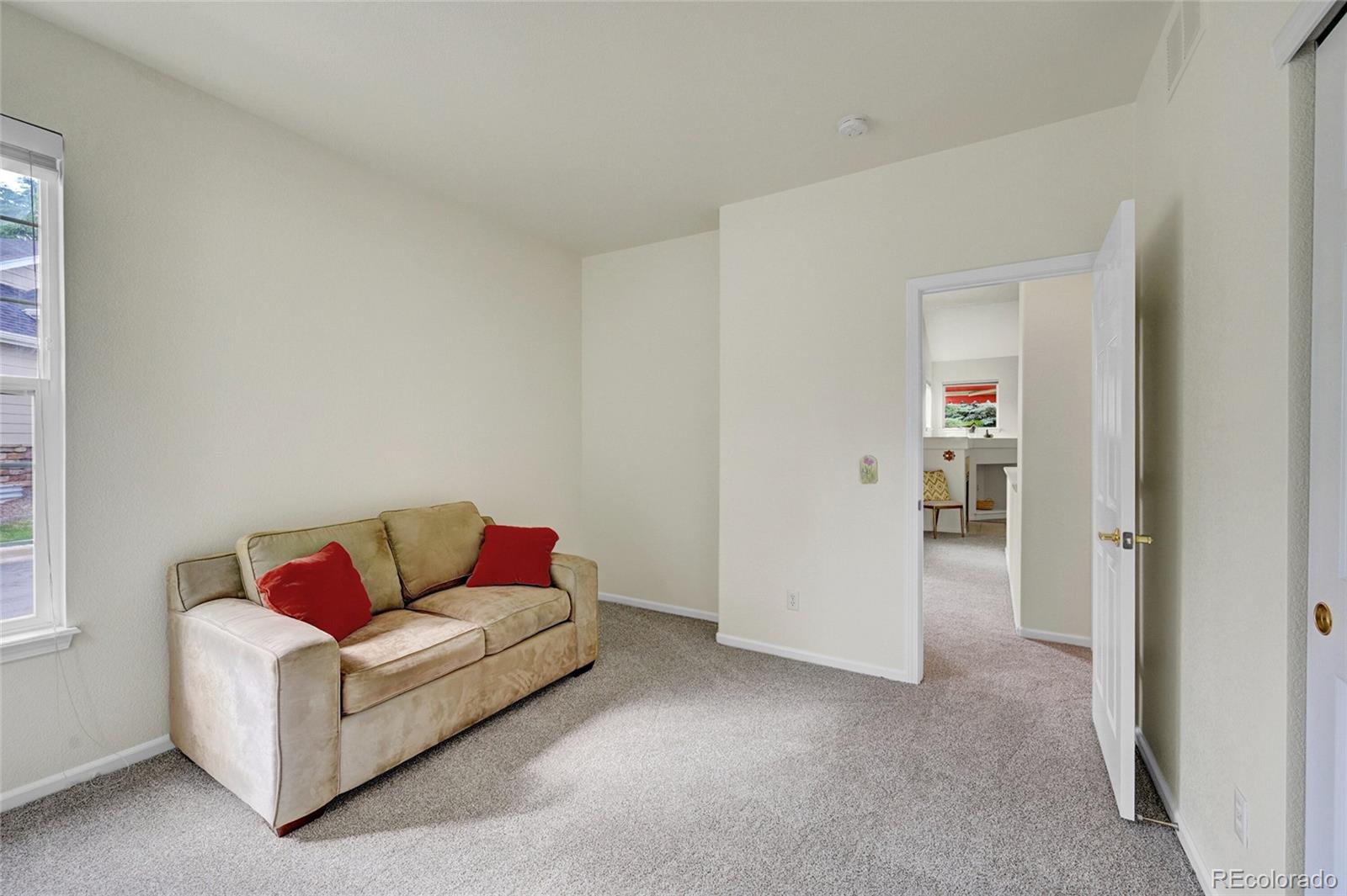 6687 South Reed Way, Unit A Littleton, CO 80123 - Photo 19 of 31 a living room with furniture and white walls