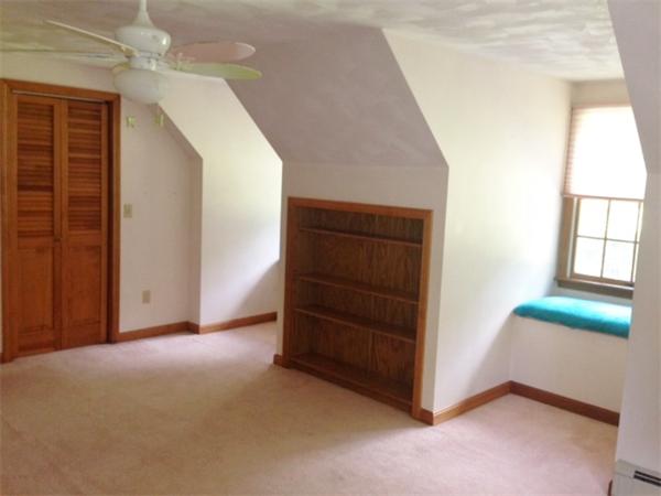 381 East County Road Rutland, MA 01543 - Photo 17 of 28 an empty room with windows and cabinet