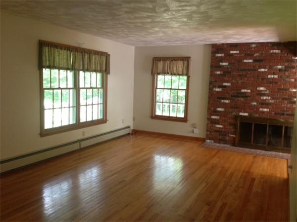 381 East County Road Rutland, MA 01543 - Photo 6 of 28 an empty room with wooden floor and windows