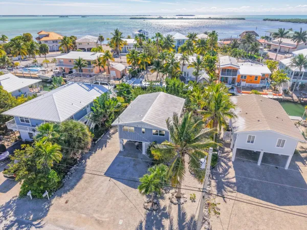 a view of a swimming pool with outdoor seating