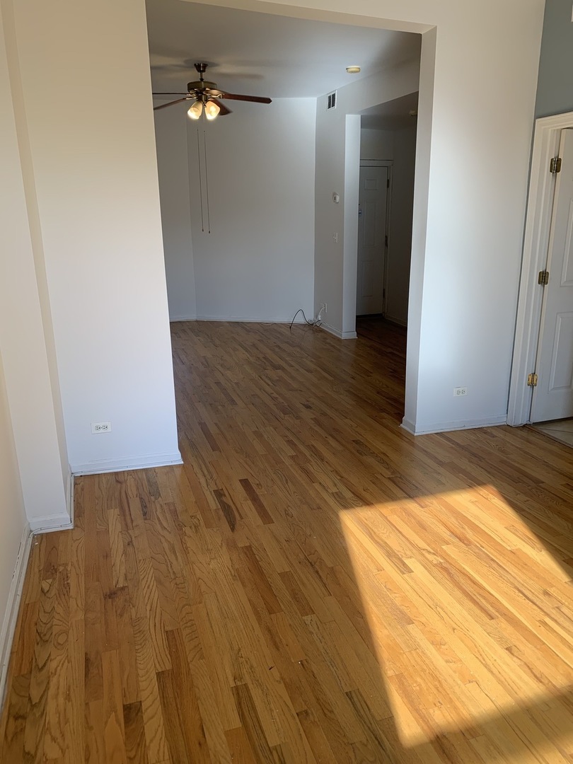 Undisclosed Address Chicago, IL 60637 - Photo 6 of 16 wooden floor in a hall with an entryway