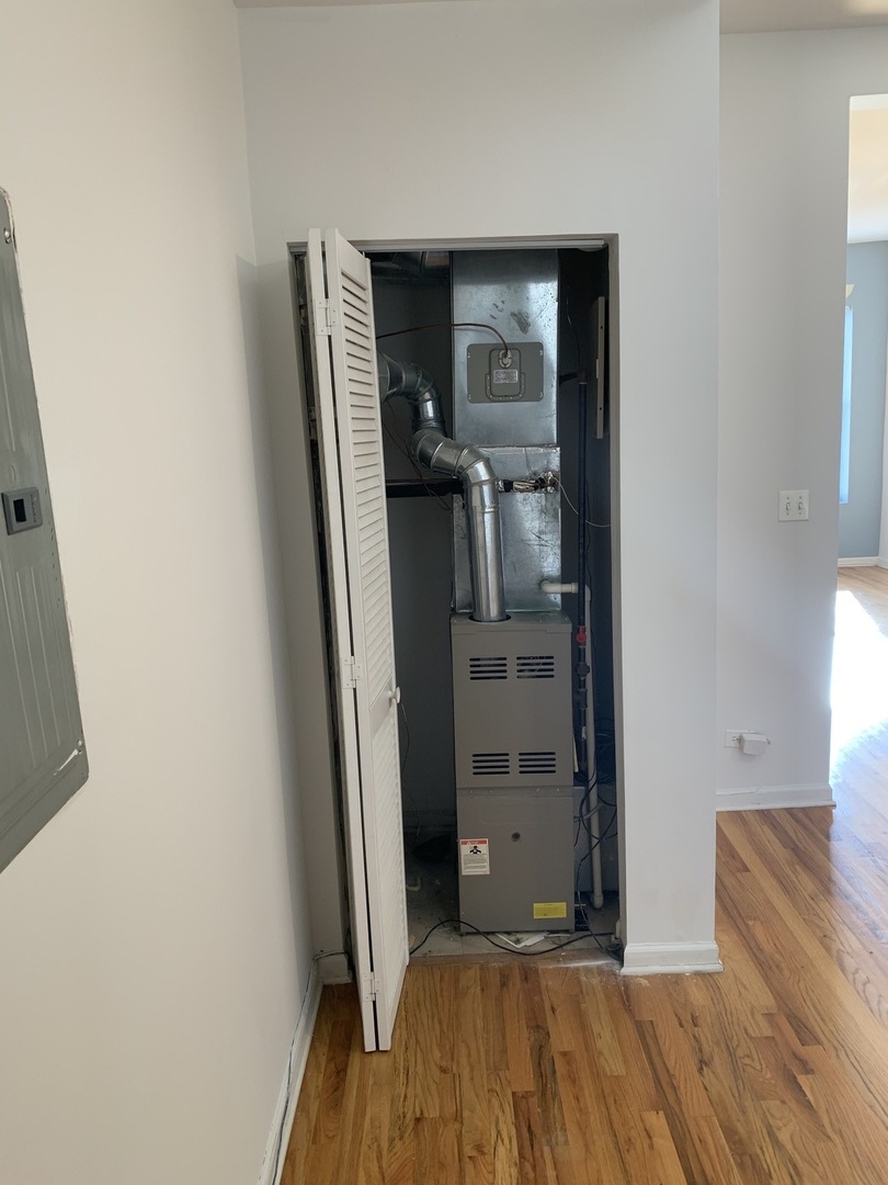 Undisclosed Address Chicago, IL 60637 - Photo 8 of 16 a view of a hallway with wooden floor and closet