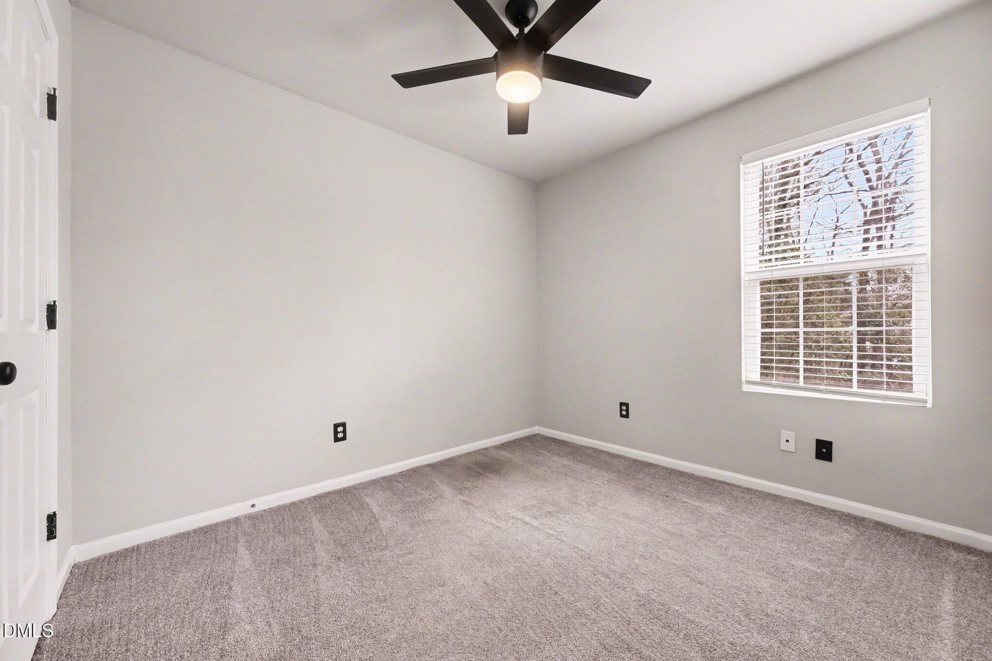 702 Brye Street Durham, NC 27703 - Photo 19 of 32 a view of an empty room with a window