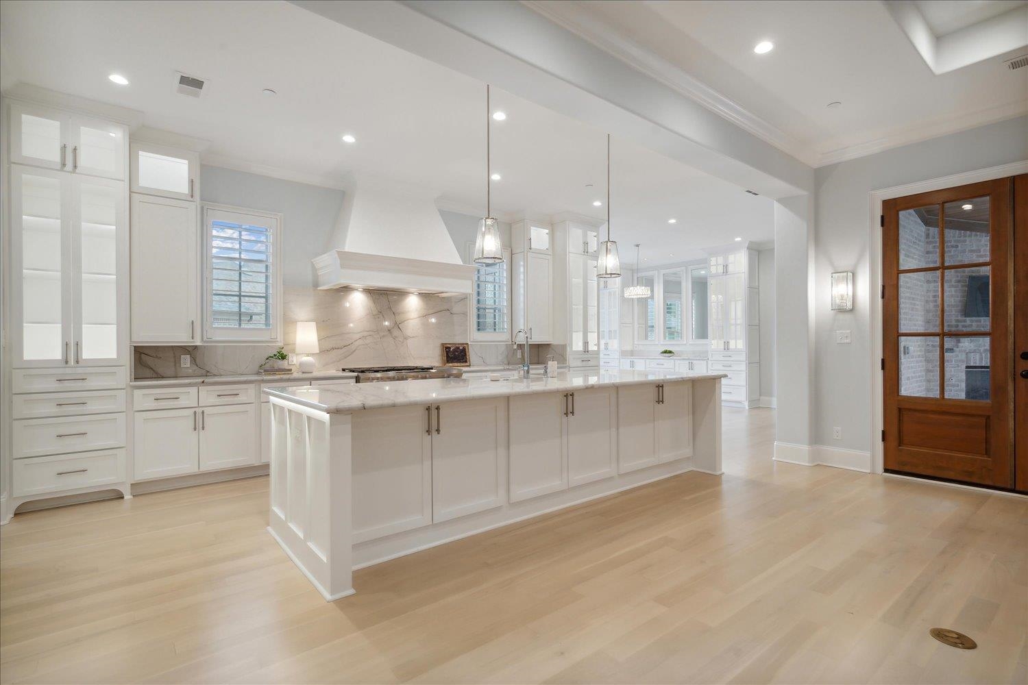 1676 Exeter Road Germantown, TN 38138 - Photo 12 of 38 a large white kitchen with a large window