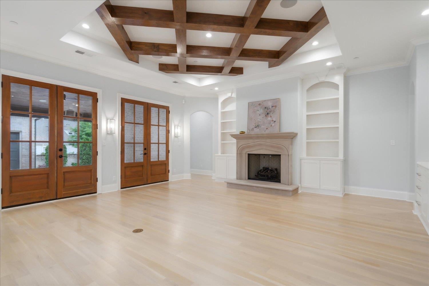 1676 Exeter Road Germantown, TN 38138 - Photo 13 of 38 a view of an empty room with a fireplace and a window