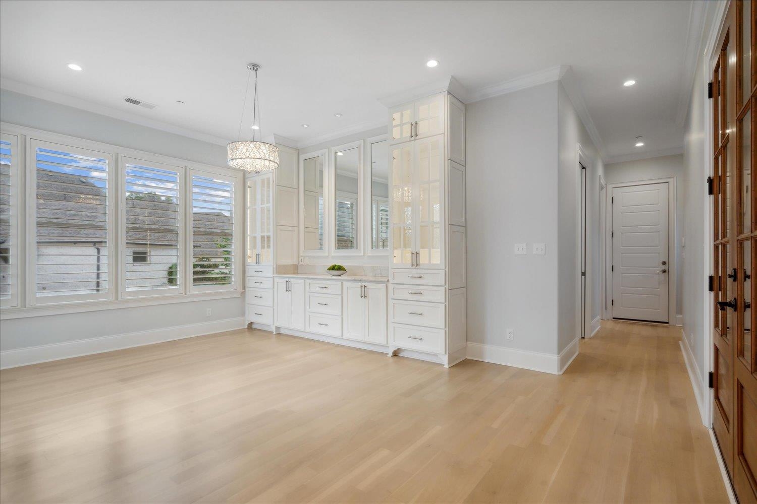 1676 Exeter Road Germantown, TN 38138 - Photo 15 of 38 an empty room with windows and cabinet