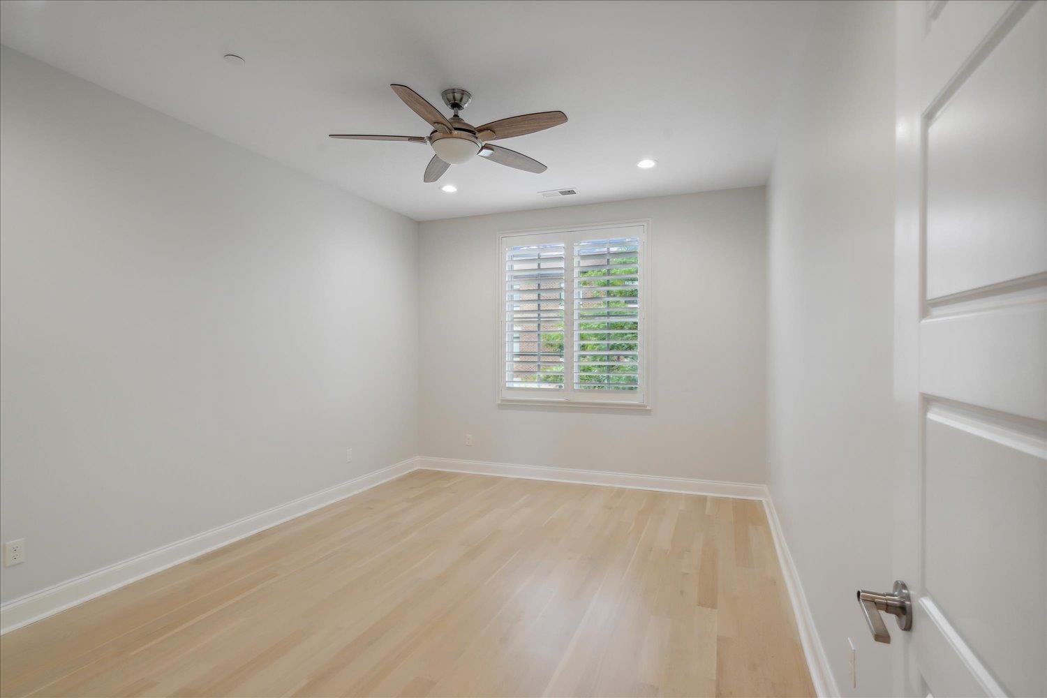 1676 Exeter Road Germantown, TN 38138 - Photo 27 of 38 wooden floor in an empty room with a window