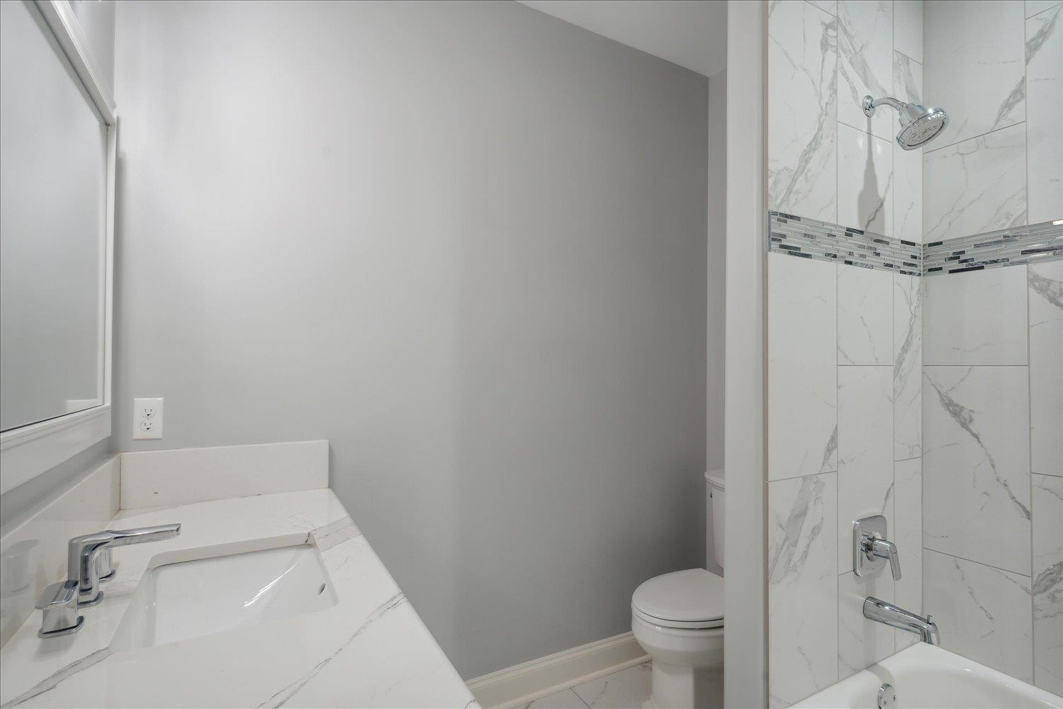 1676 Exeter Road Germantown, TN 38138 - Photo 28 of 38 a bathroom with a sink and toilet