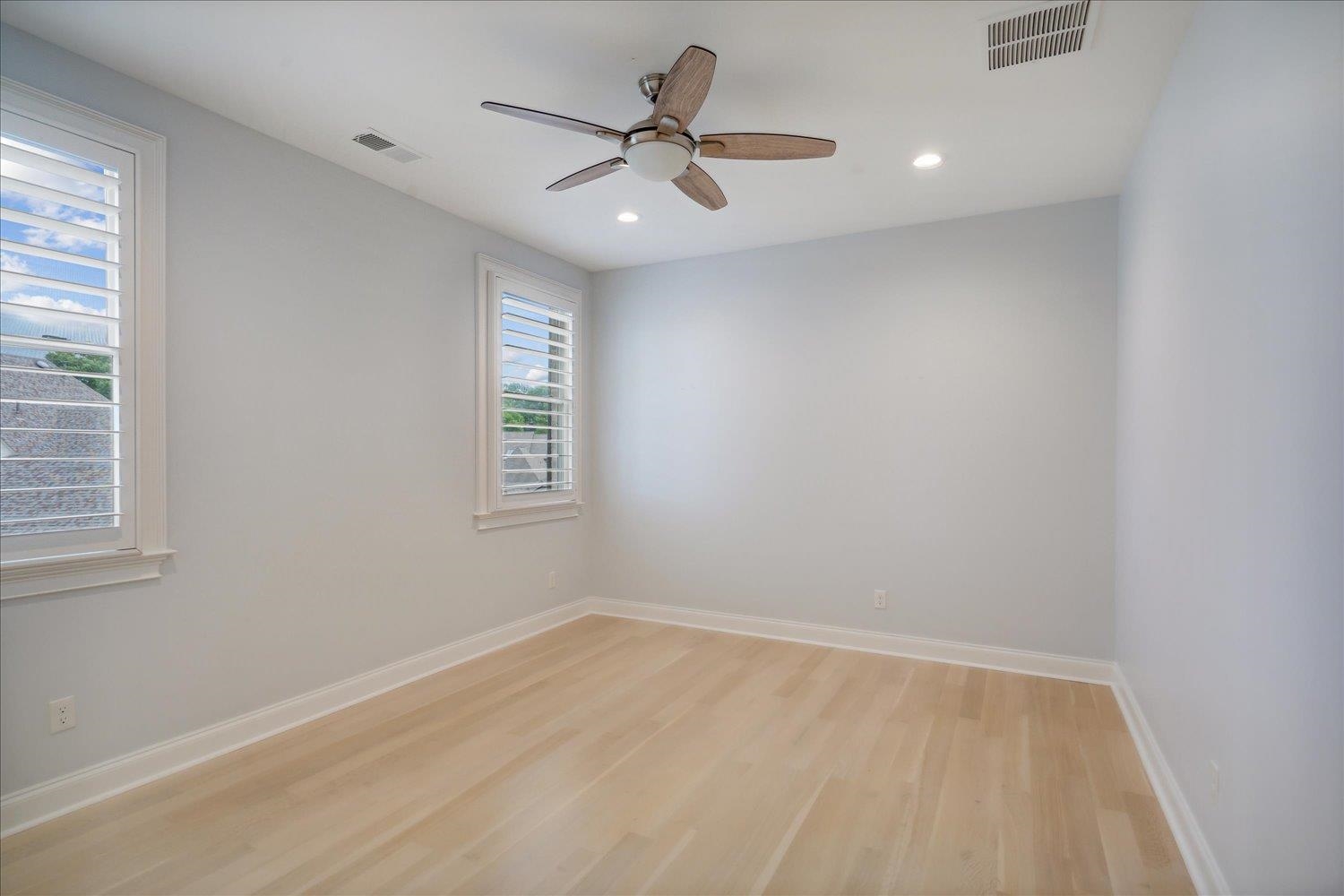 1676 Exeter Road Germantown, TN 38138 - Photo 30 of 38 an empty room with a window and a fan