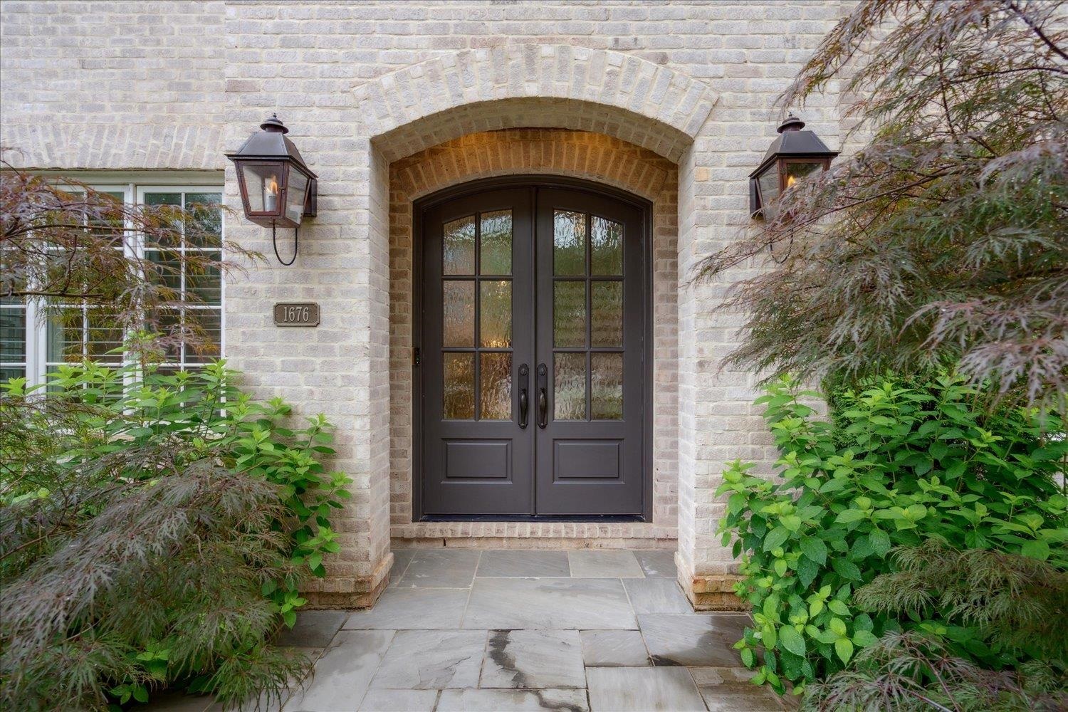 1676 Exeter Road Germantown, TN 38138 - Photo 3 of 38 a front view of a house with a yard