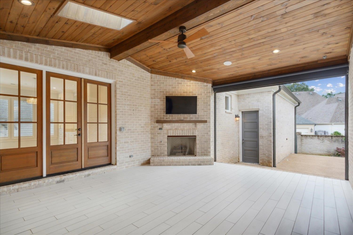 1676 Exeter Road Germantown, TN 38138 - Photo 32 of 38 a view of an empty room with a fireplace and a window