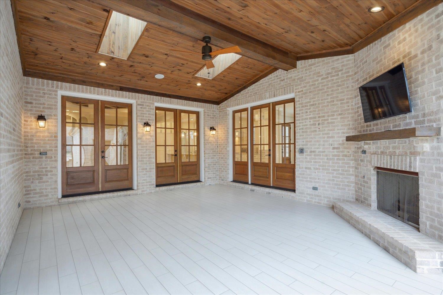 1676 Exeter Road Germantown, TN 38138 - Photo 33 of 38 a view of an empty room with a fireplace and a window