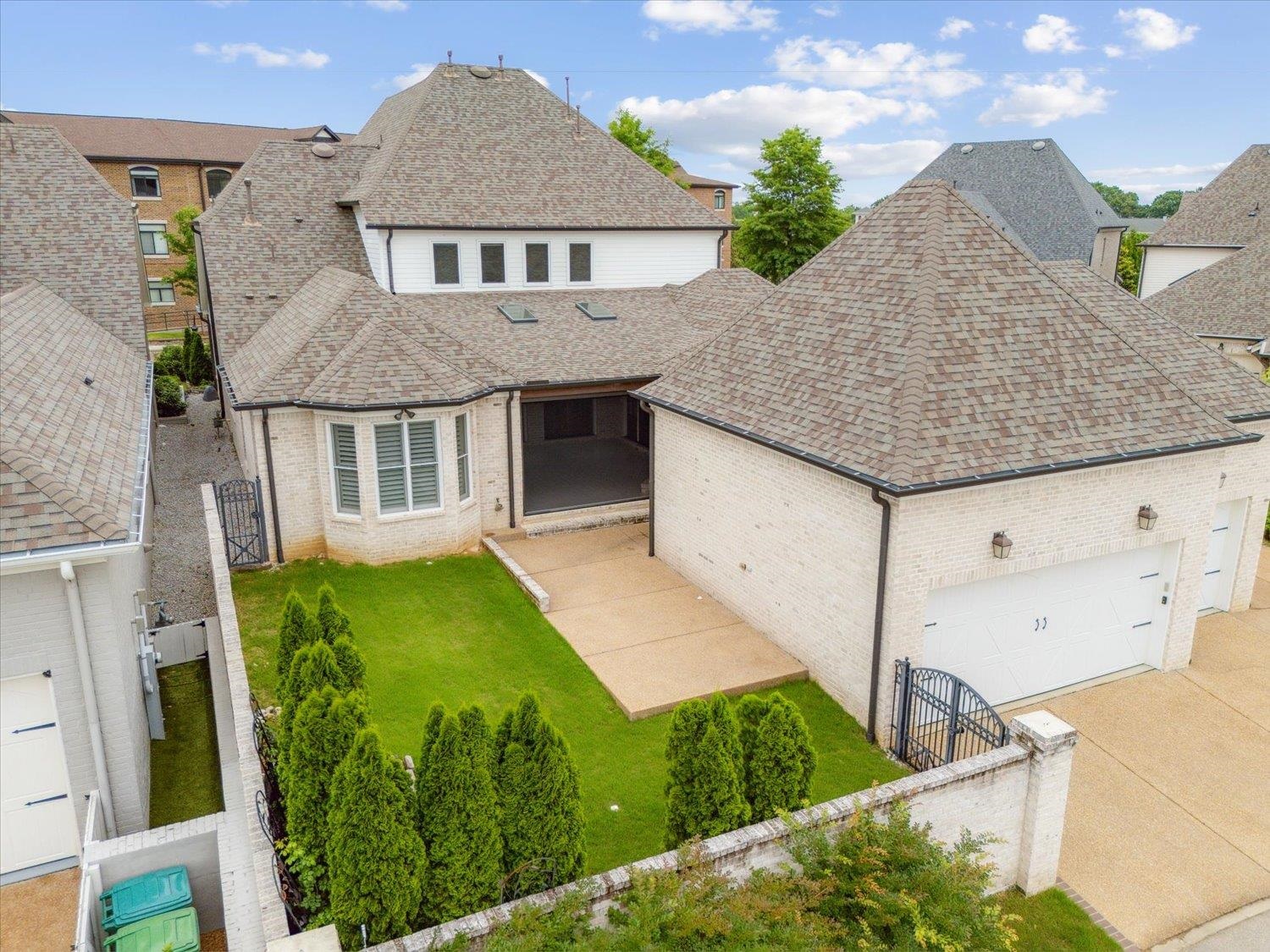 1676 Exeter Road Germantown, TN 38138 - Photo 36 of 38 a aerial view of a house next to a yard