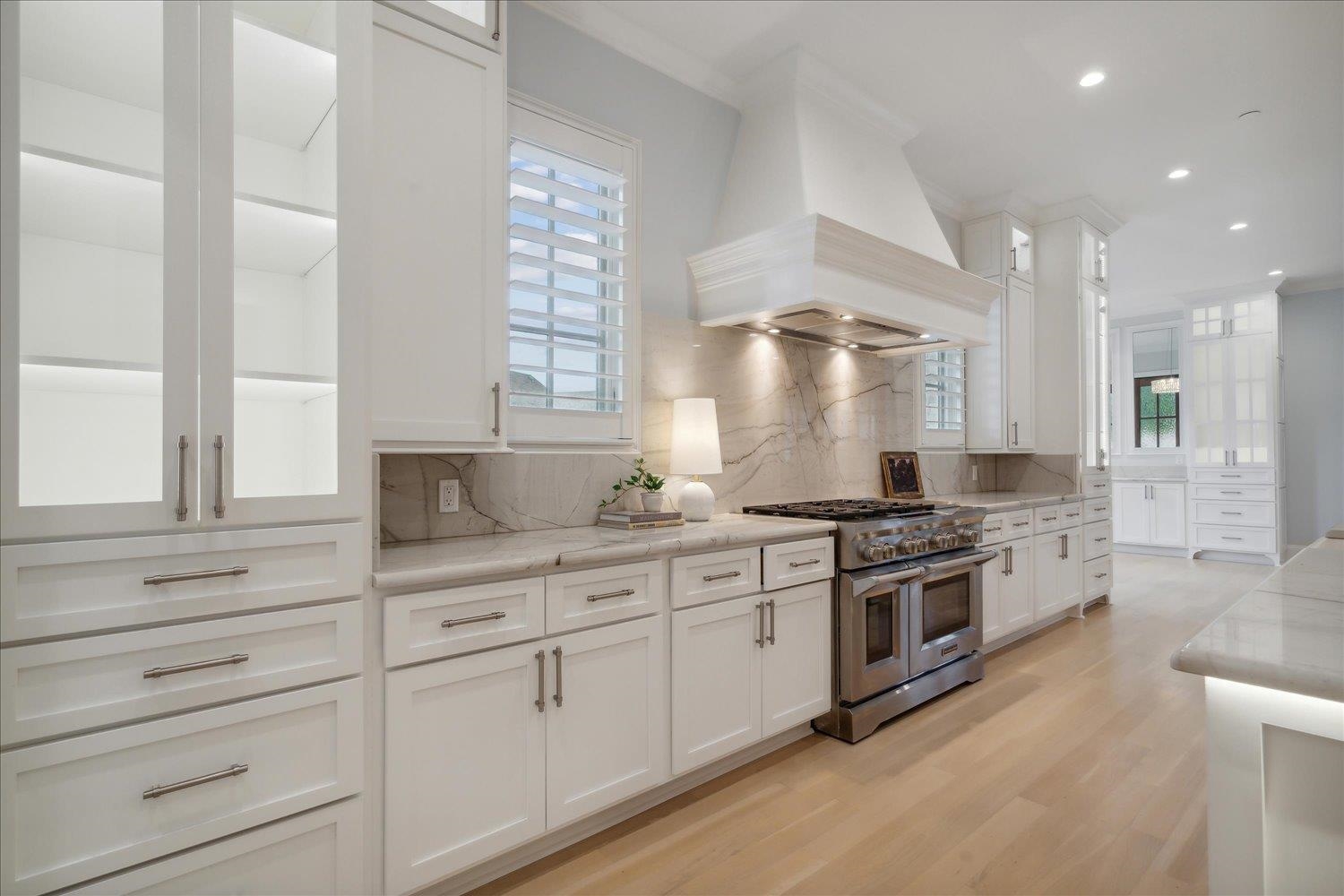 1676 Exeter Road Germantown, TN 38138 - Photo 8 of 38 a large kitchen with stainless steel appliances granite countertop a stove and a sink