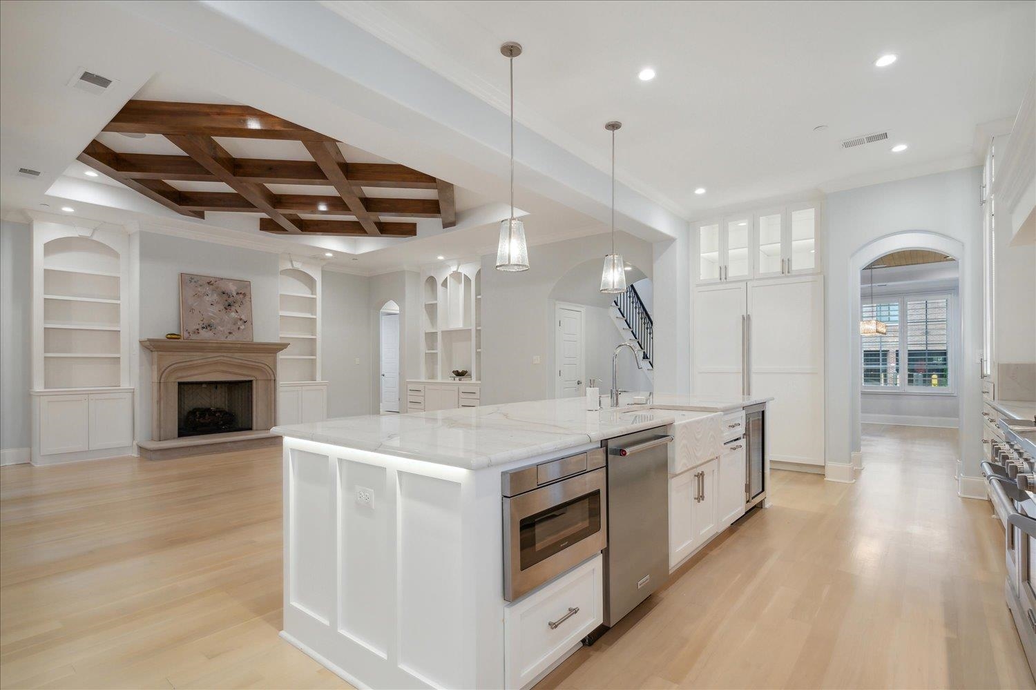 1676 Exeter Road Germantown, TN 38138 - Photo 10 of 38 a kitchen with stainless steel appliances granite countertop a stove and a wooden floors