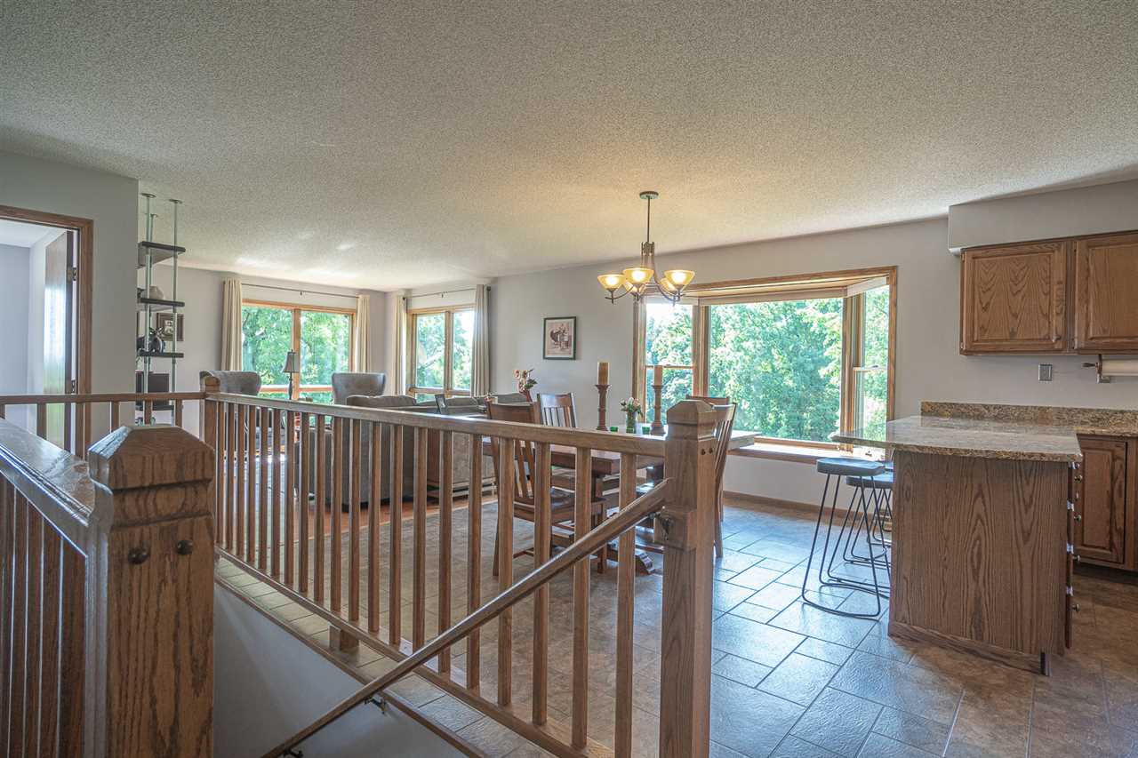 1783 West Pines Road Oregon, IL 61061 - Photo 5 of 24 a view of a livingroom with furniture and staircase