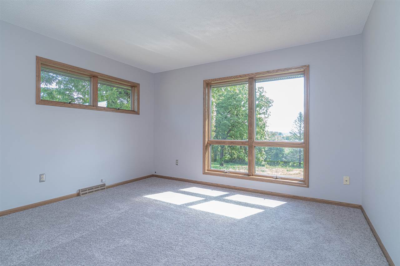 1783 West Pines Road Oregon, IL 61061 - Photo 7 of 24 an empty room with a window