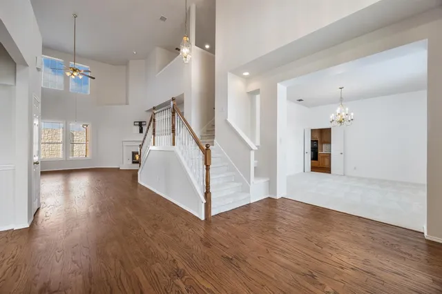 a view of a room wooden floor and staircase