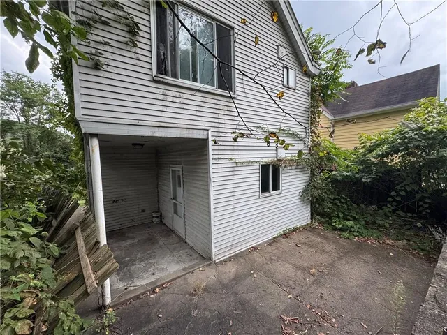 a view of a house with a yard and garage