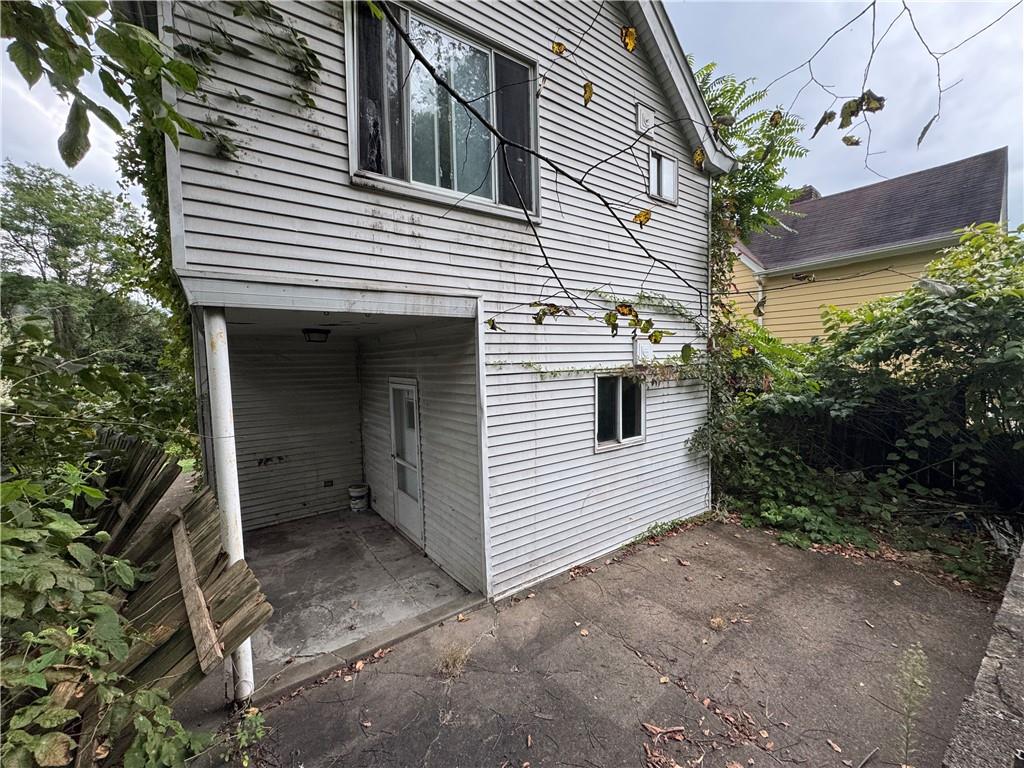 42 Sprague Street Wilmerding, PA 15148 - Photo 4 of 4 a view of a house with a yard and garage