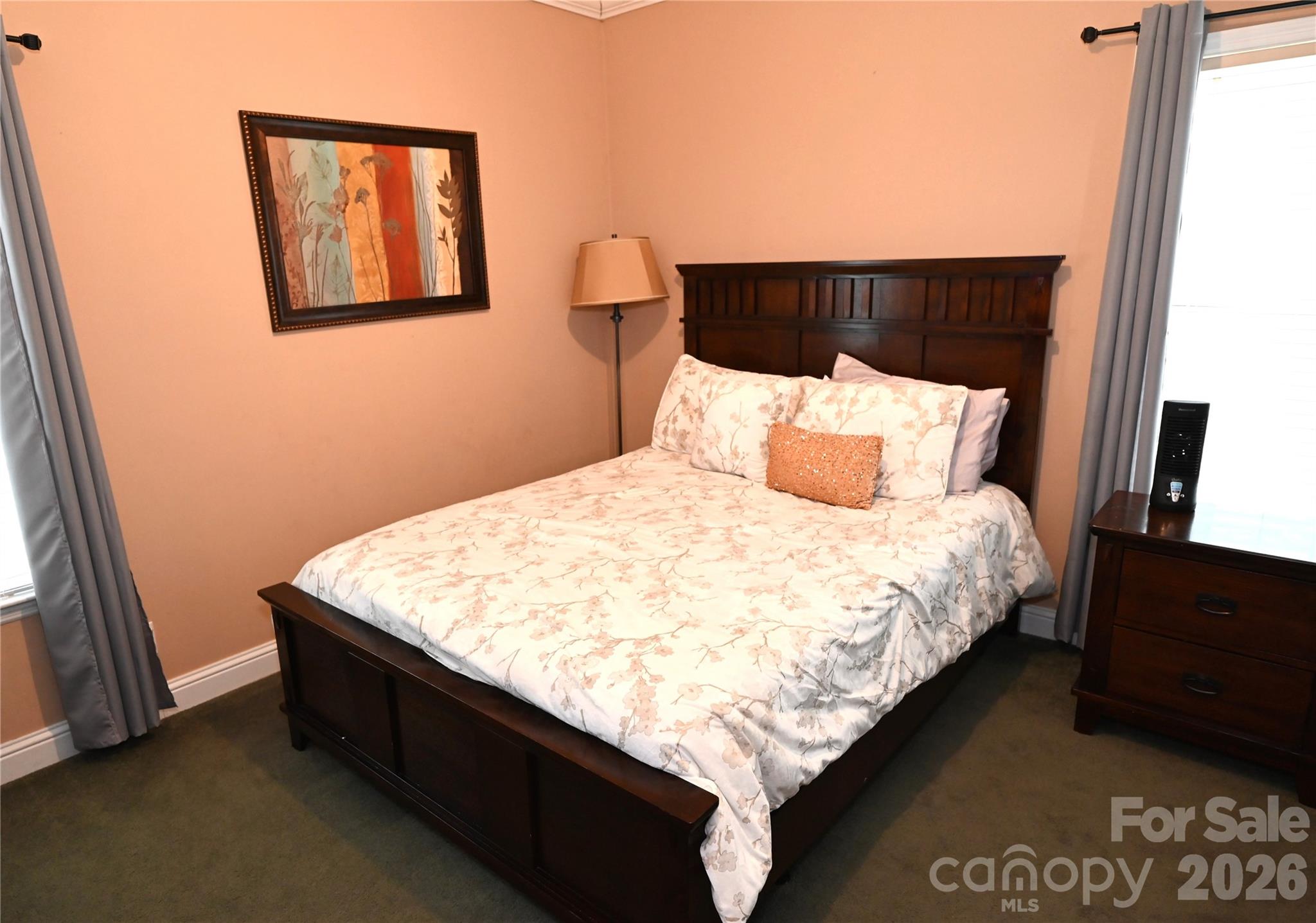 3951 Springs Road Northeast Conover, NC 28613 - Photo 17 of 19 a bed sitting in a bedroom next to a window