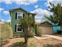 12209 Briarcreek Loop Manor, TX 78653 - Photo 2 of 23 a front view of a house with a yard