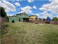 12209 Briarcreek Loop Manor, TX 78653 - Photo 22 of 23 a view of a building with a yard