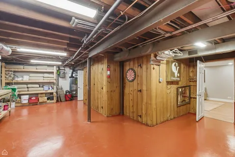 a view of empty room with wooden shelves