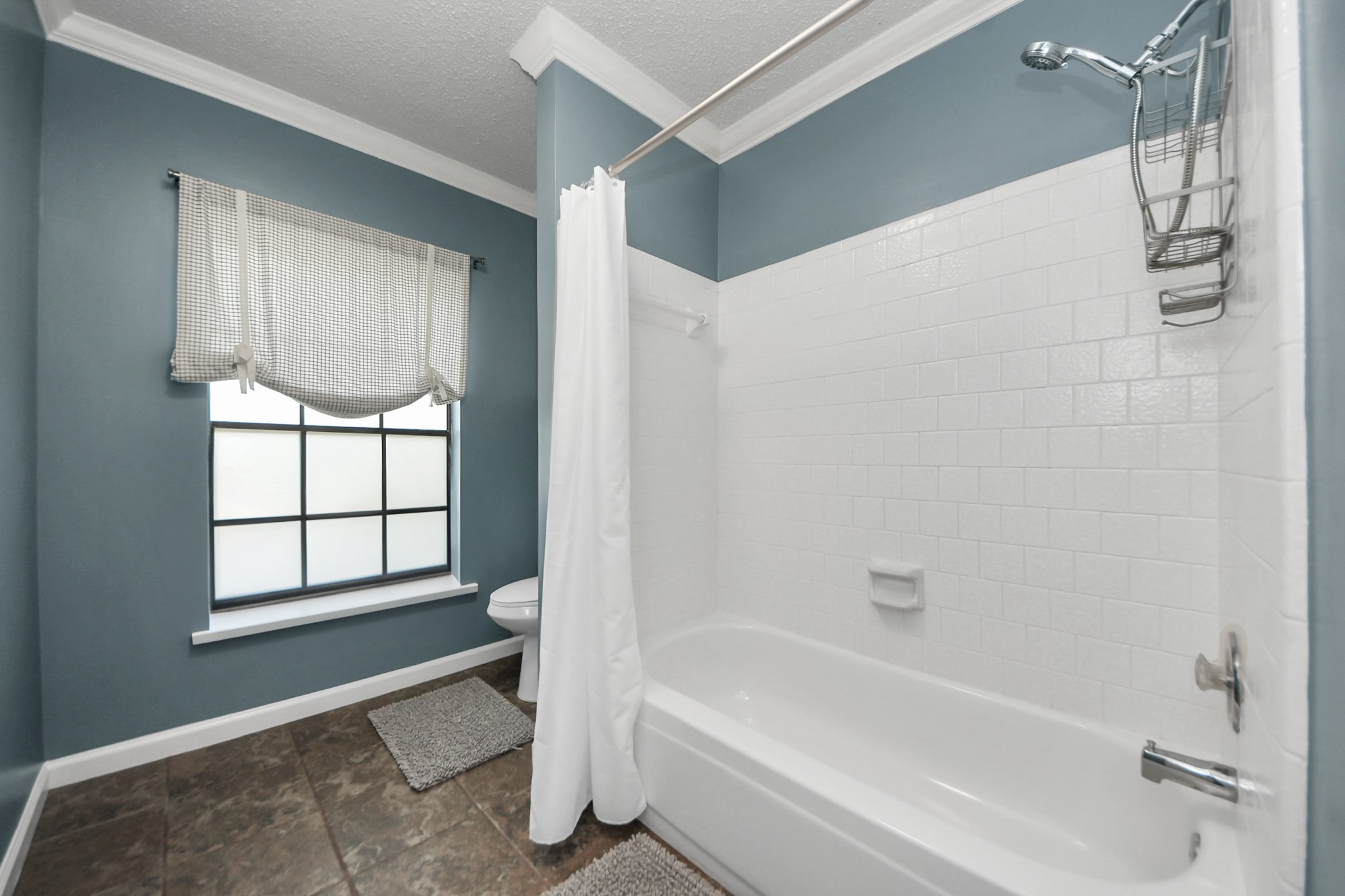 3107 Dulaney Road Houston, TX 77084 - Photo 39 of 50 a bathroom with a tub shower and window