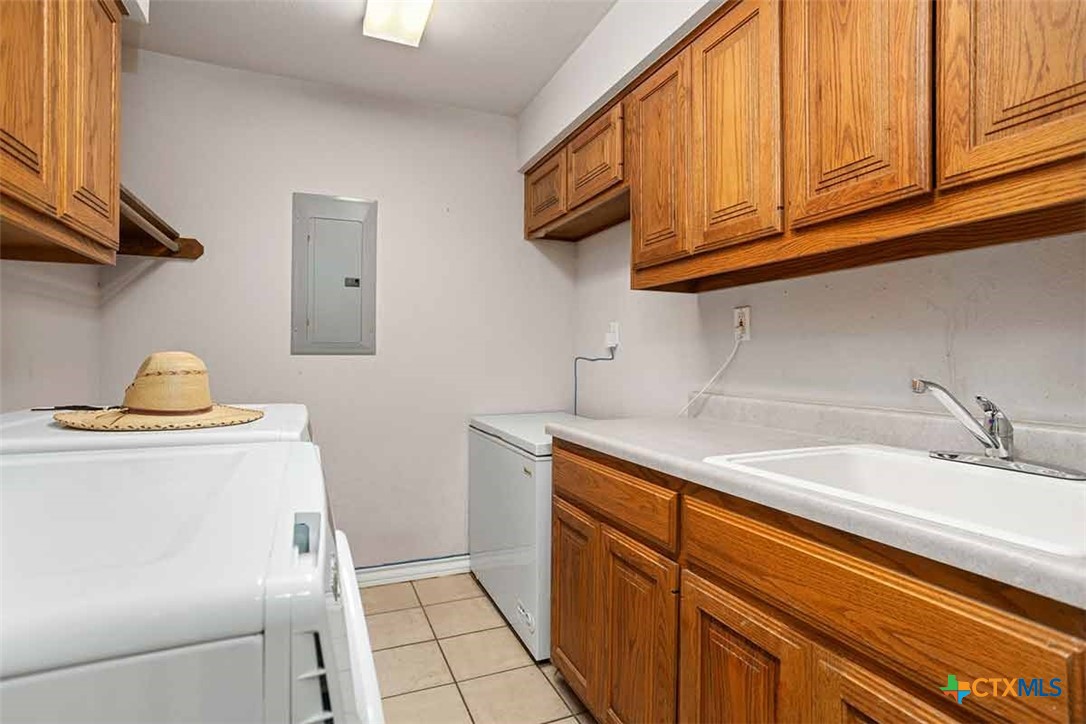 20-acres Guadalupe Ranch Lane Seguin, TX 78155 - Photo 23 of 42 a kitchen with a sink and cabinets