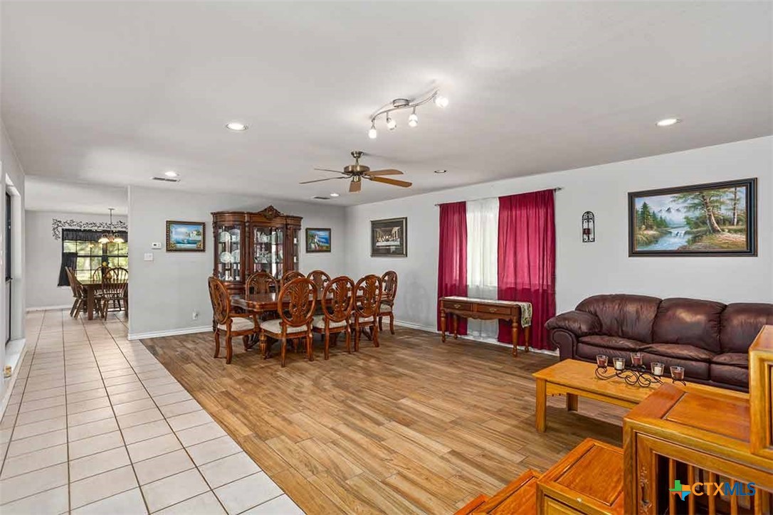 20-acres Guadalupe Ranch Lane Seguin, TX 78155 - Photo 26 of 42 a living room with furniture a dining table and chairs next to a window