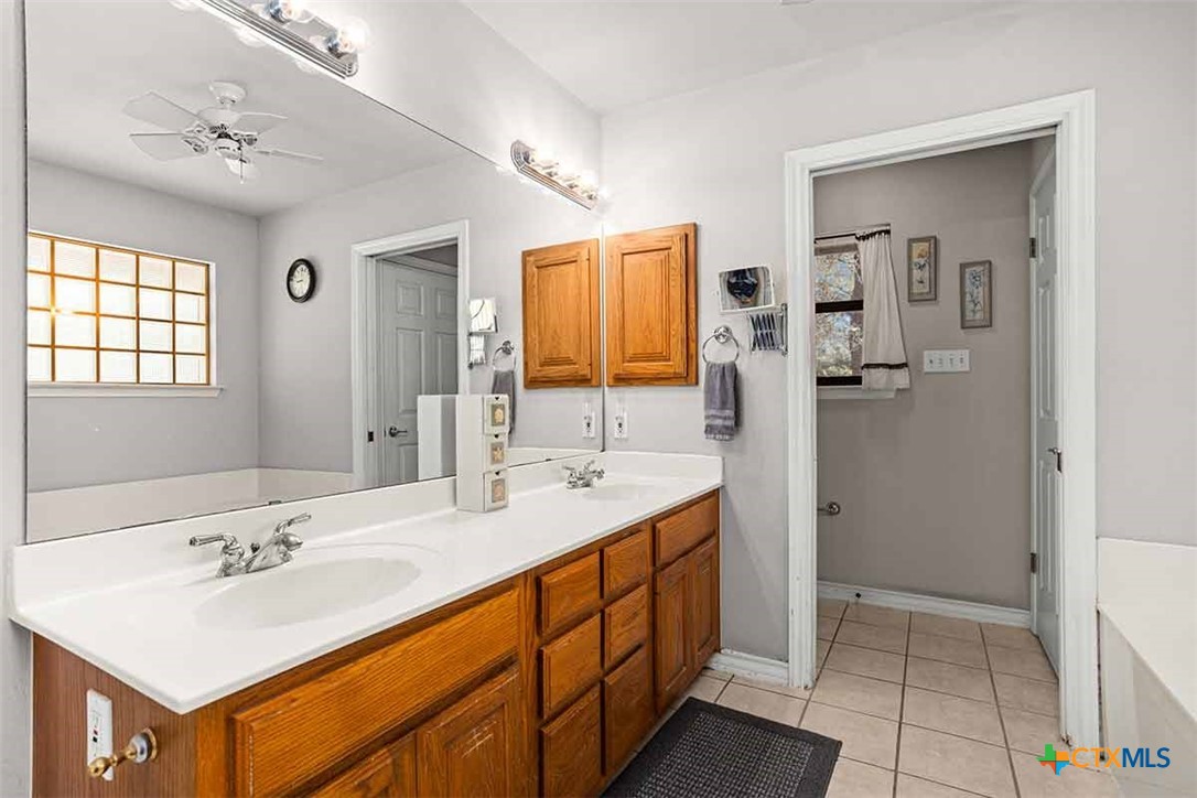 20-acres Guadalupe Ranch Lane Seguin, TX 78155 - Photo 35 of 42 a bathroom with a sink double vanity and a shower