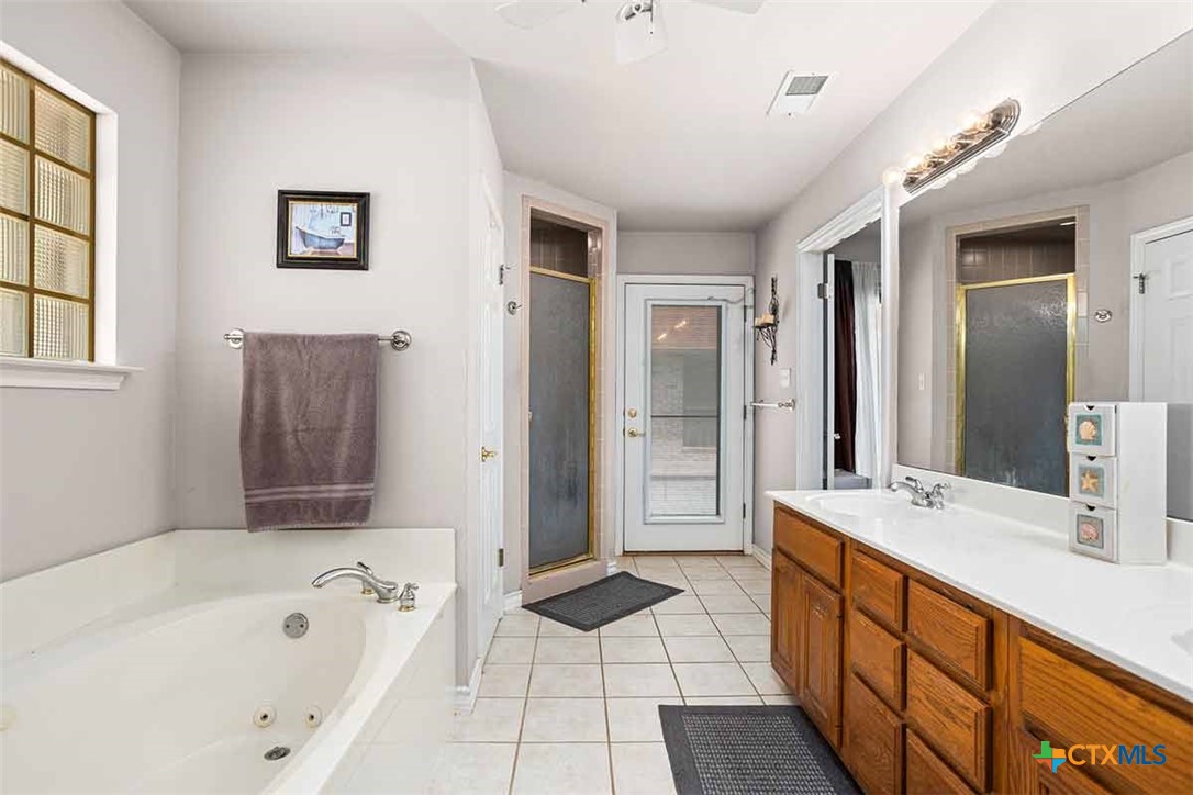 20-acres Guadalupe Ranch Lane Seguin, TX 78155 - Photo 36 of 42 a spacious bathroom with a tub sink shower and mirror