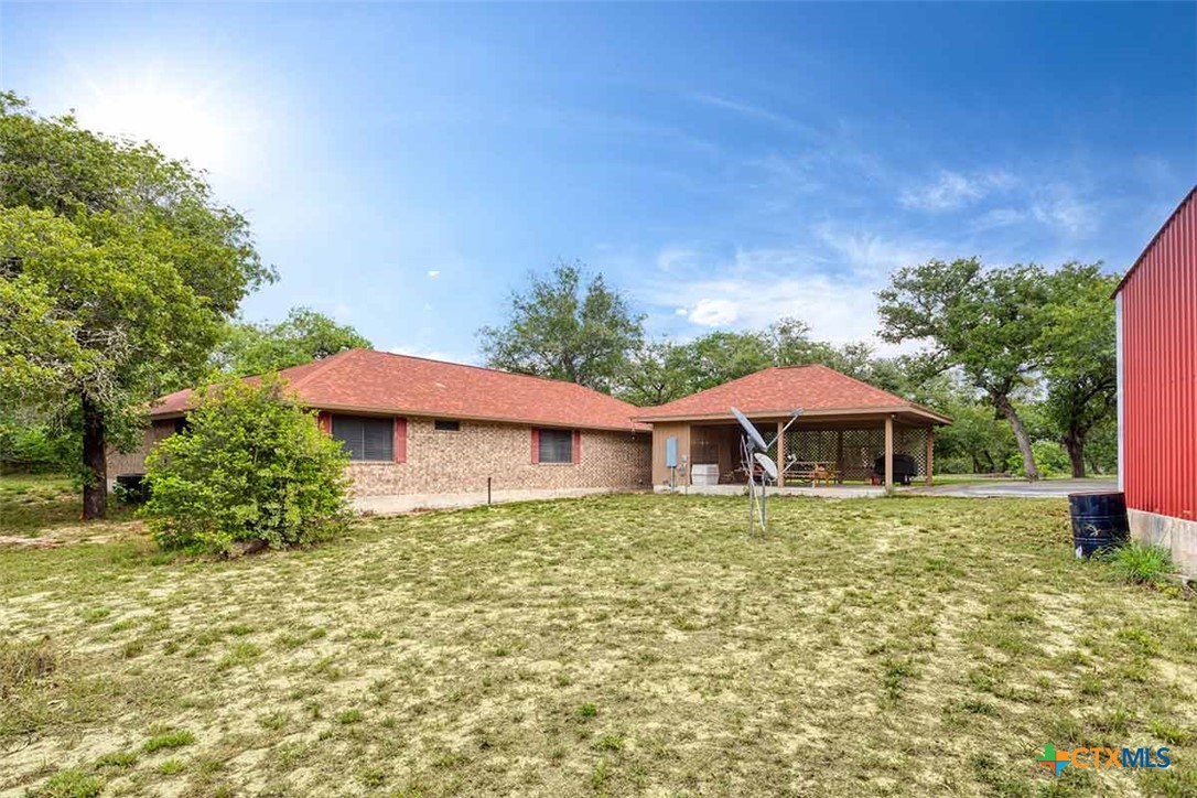 20-acres Guadalupe Ranch Lane Seguin, TX 78155 - Photo 39 of 42 a white house with a yard and sitting area