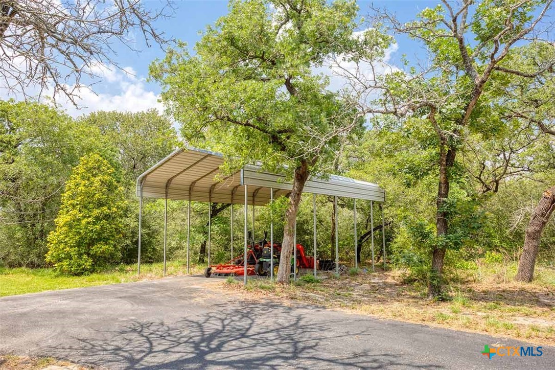 20-acres Guadalupe Ranch Lane Seguin, TX 78155 - Photo 10 of 42 a view of a patio with a table and chairs under an umbrella