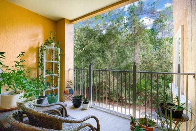 a balcony with outdoor seating