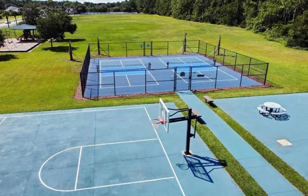 a view of a swimming pool with a yard