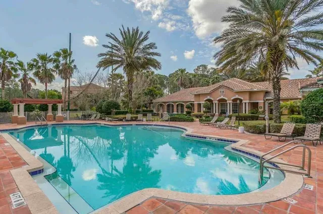 a view of a swimming pool with a garden