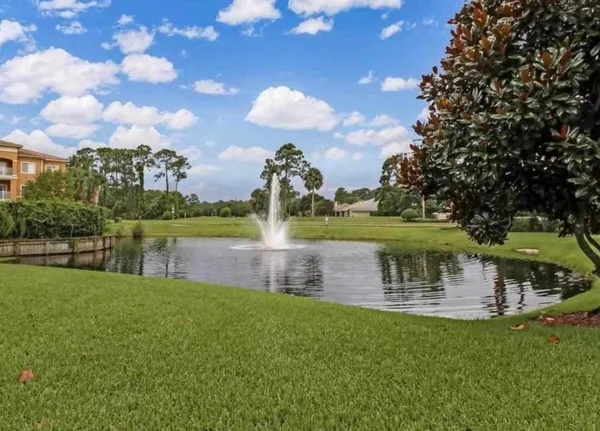 a view of a lake with a yard