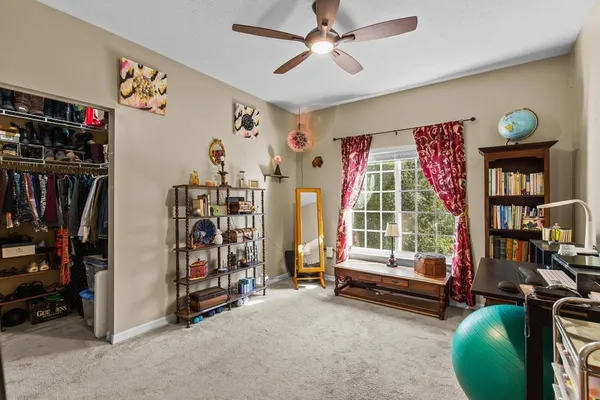 a bedroom with furniture and a window