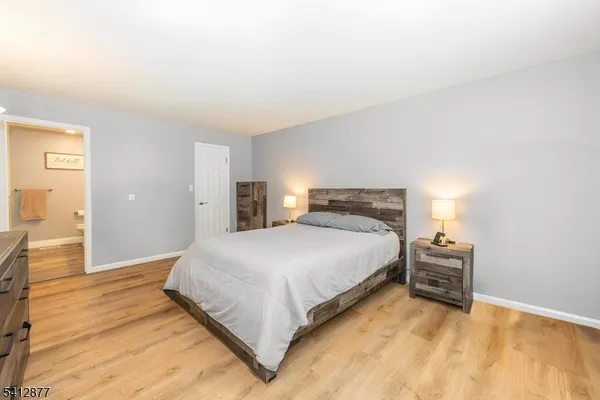 a bedroom with a bed and dresser