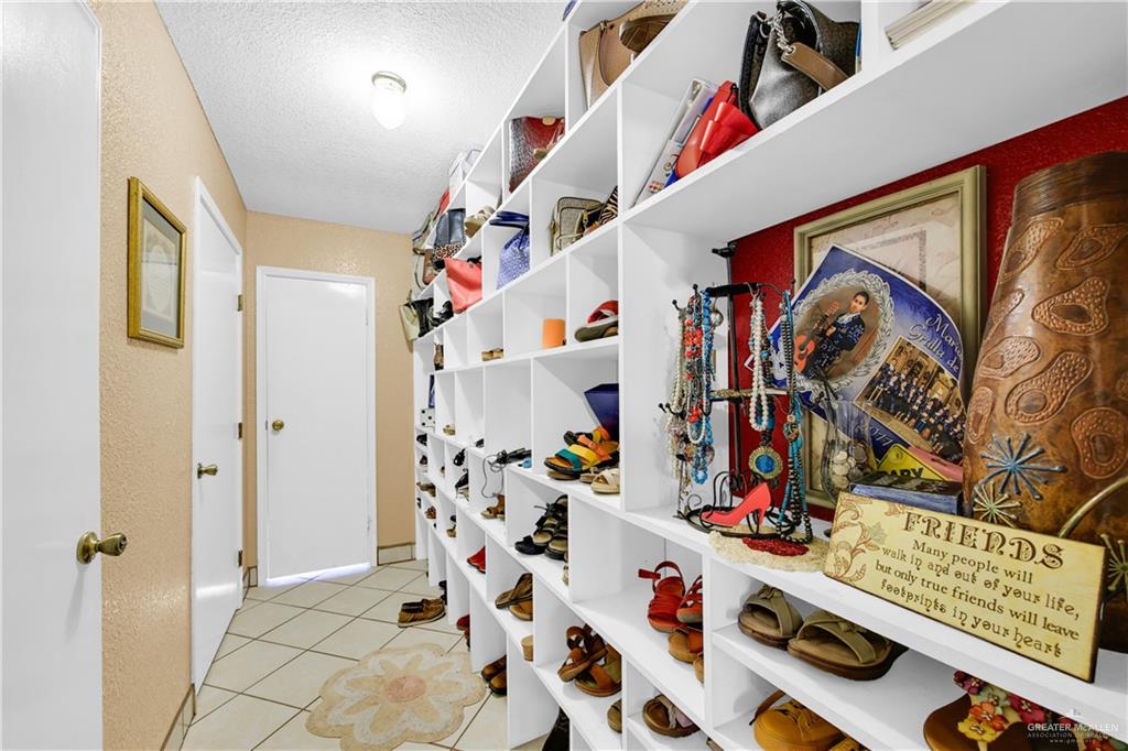 695 El Paisano Road Rio Grande City, TX 78582 - Photo 14 of 30 Walk in closet with light tile patterned floors