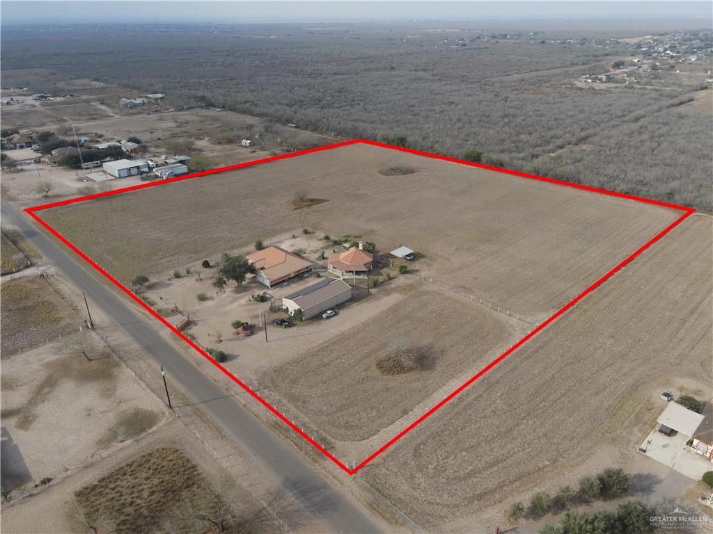 695 El Paisano Road Rio Grande City, TX 78582 - Photo 27 of 30 Aerial view of sparsely populated area with property boundaries highlighted