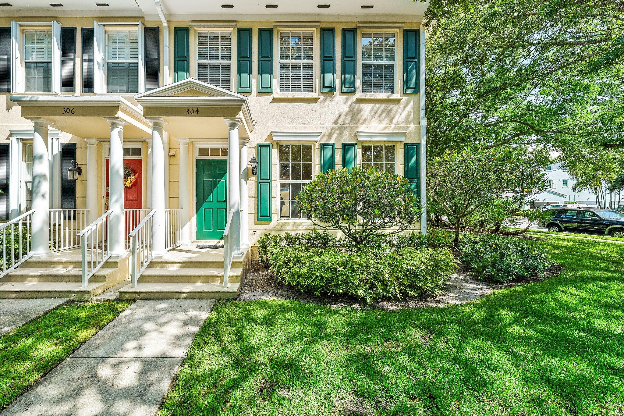 304 Legare Court Jupiter, FL 33458 - Photo 2 of 38 a front view of a house with a yard