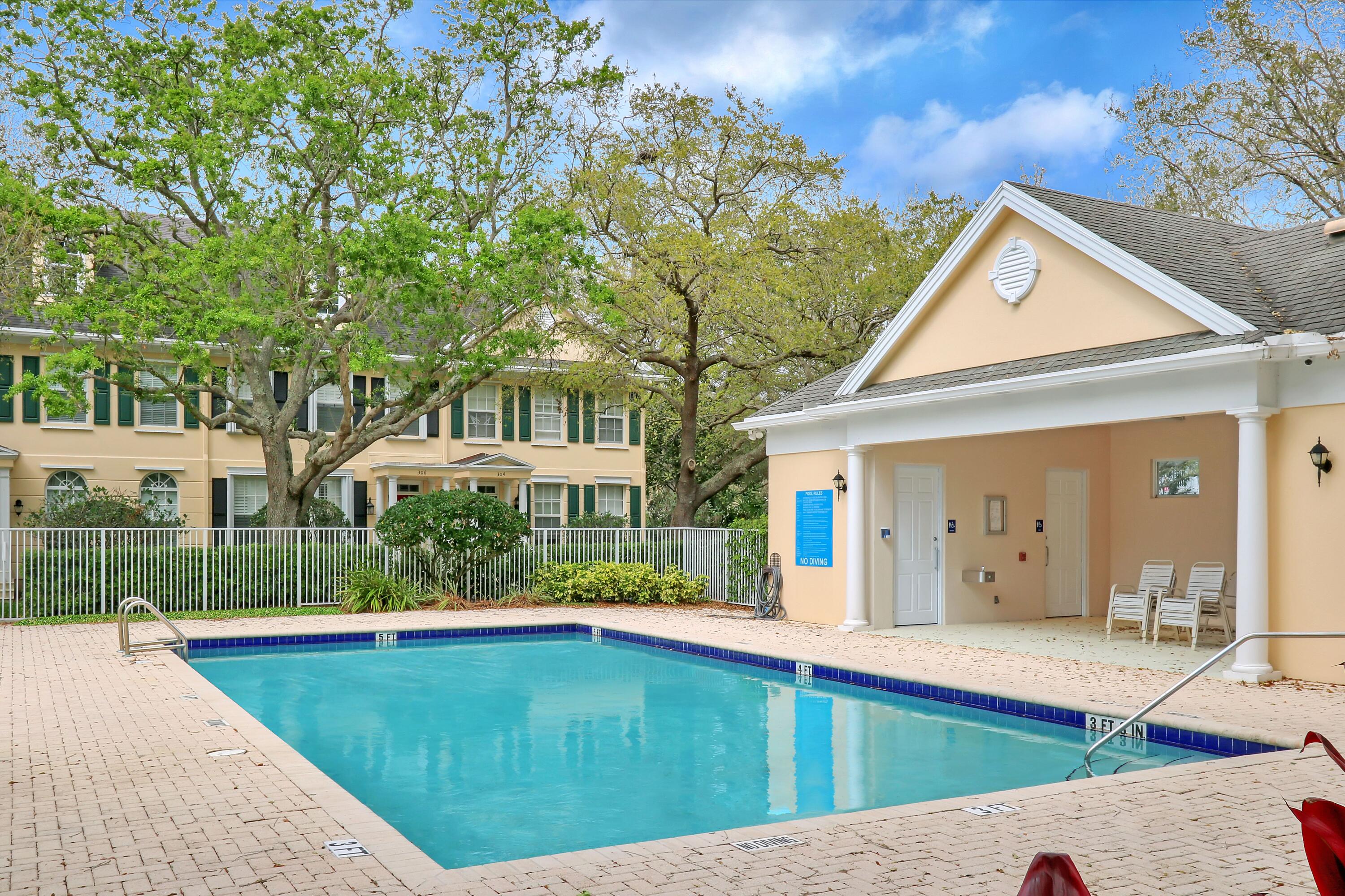 304 Legare Court Jupiter, FL 33458 - Photo 38 of 38 a view of swimming pool with lawn chairs and plants